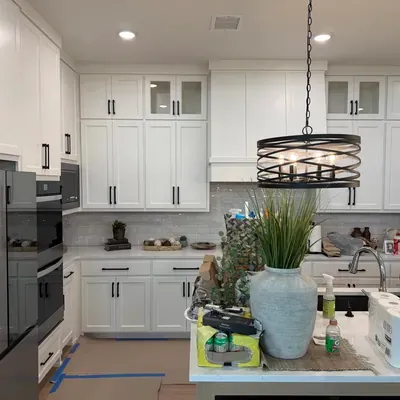 White shaker kitchen remodel with black hardware and pendant lighting — Prosper, TX | Goldstar Renovations